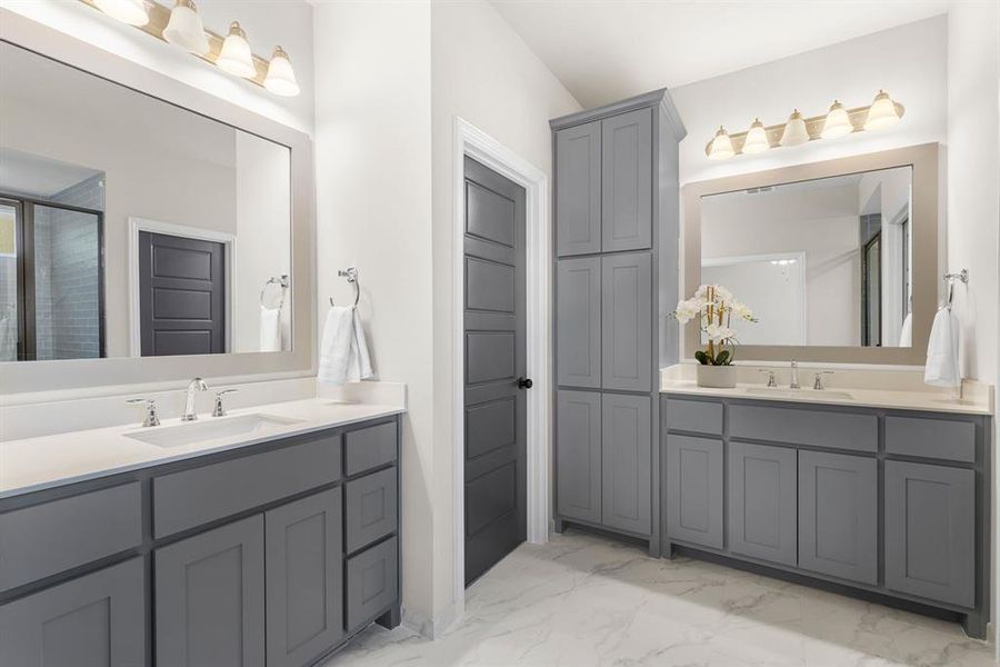 Bathroom featuring tile patterned flooring and vanity