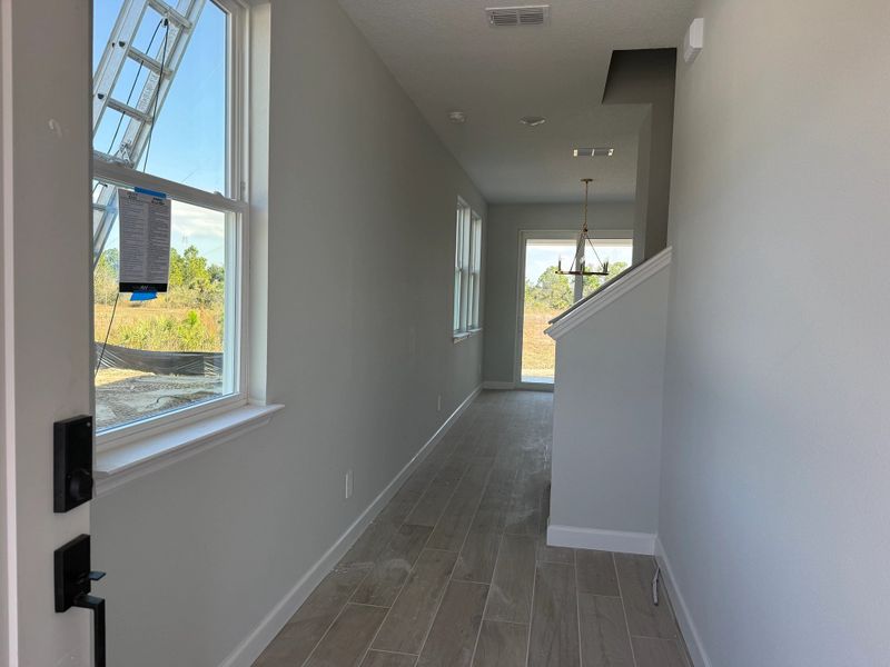 Elongated foyer welcomes visitors into the home
