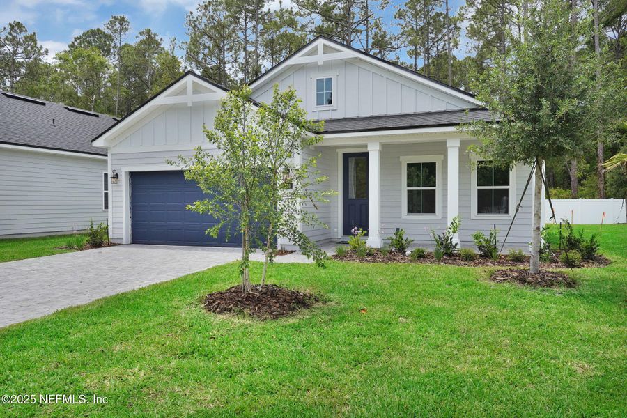 Front exterior of a new home in Landing at Olde Florida, St. Augustine, FL, highlighting curb appeal (Image 20).