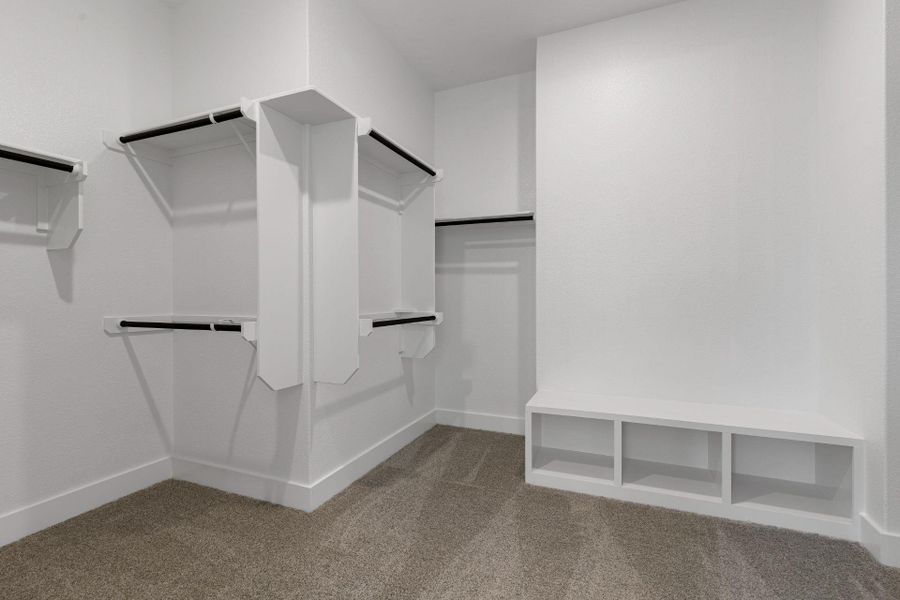 Walk-in closet in Primary Bedroom Walk-in closet in Primary Bedroom