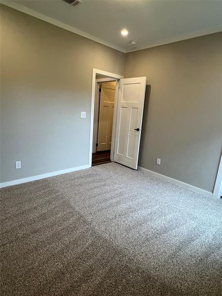 Unfurnished room with carpet, ornamental molding, and recessed lighting