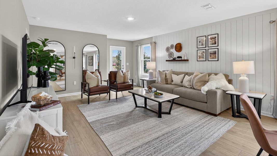 Representative furnished interior of a home built from the Harper+ by D.R. Horton in Rookery, Green Cove Springs (Image 12).