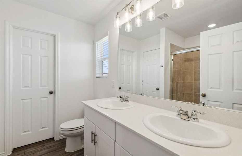 Owner's bath with dual vanity *real home pictured