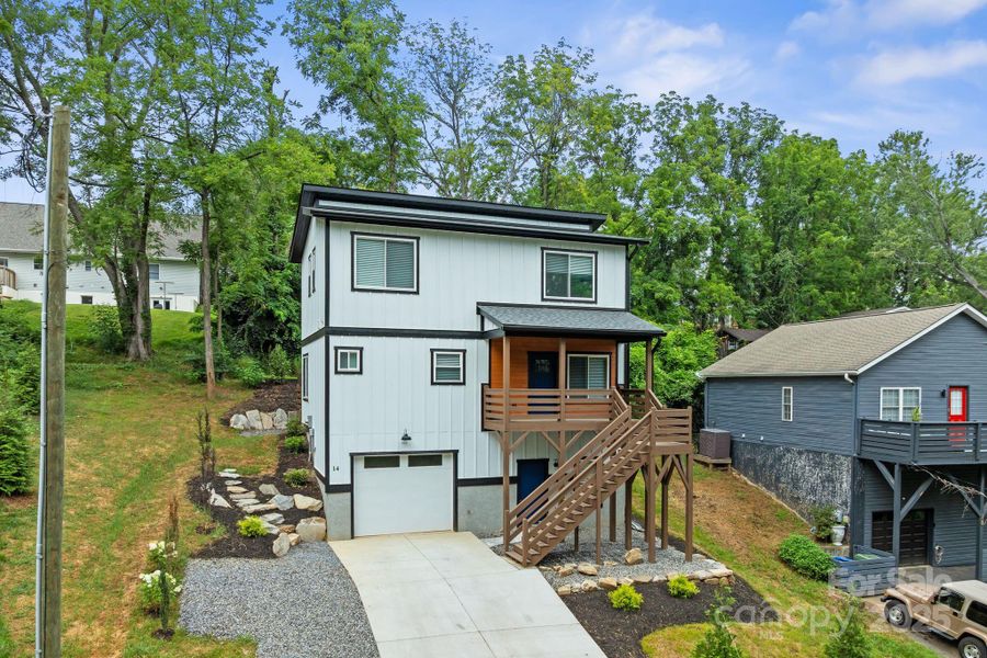 Front exterior of a new home in , Asheville, NC, highlighting curb appeal (Image 1). Front exterior of a new home in , Asheville, NC, highlighting curb appeal (Image 1).