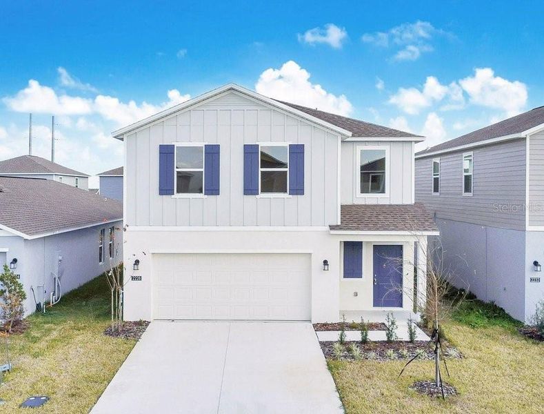 Front exterior of a new home in , Winter Haven, FL, highlighting curb appeal (Image 2). Front exterior of a new home in , Winter Haven, FL, highlighting curb appeal (Image 2).