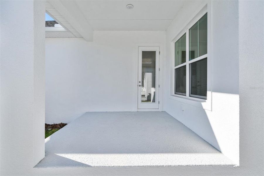 Exterior details and patio area of a home in Emerald Landing at Waterside at Lakewood Ranch – Cottage Series, Sarasota (Image 3). Exterior details and patio area of a home in Emerald Landing at Waterside at Lakewood Ranch – Cottage Series, Sarasota (Image 3).