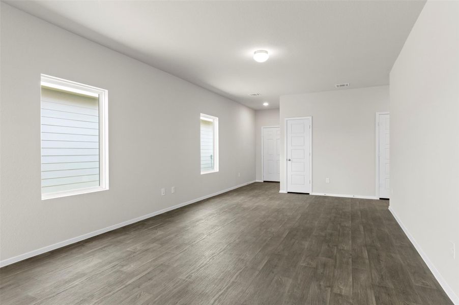 Spare room with dark wood-type flooring Spare room with dark wood-type flooring