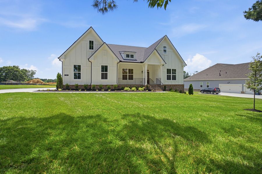 Front exterior of a new home in Belvoir, Fairview, TN, highlighting curb appeal (Image 24). Front exterior of a new home in Belvoir, Fairview, TN, highlighting curb appeal (Image 24).