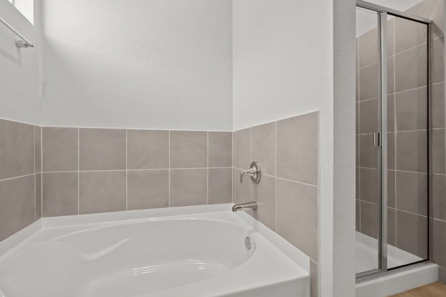 A bathtub in a bathroom.