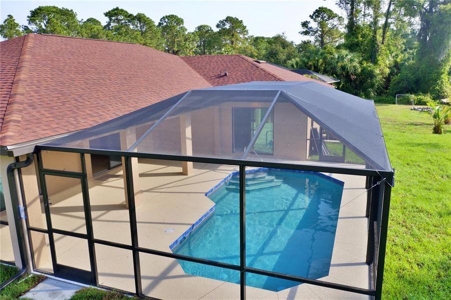 Exterior details and patio area of a home in , North Port (Image 31).