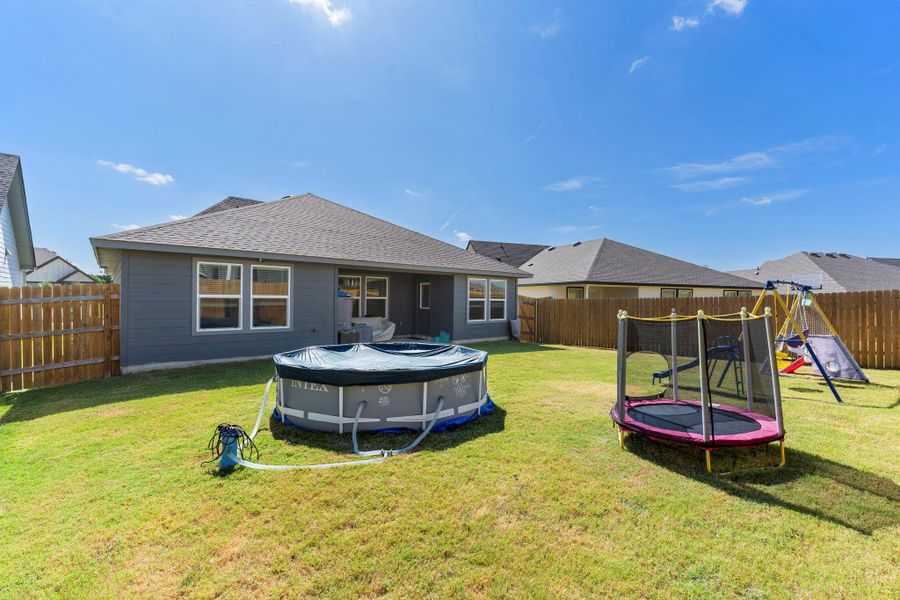 A fenced backyard offers ample space for outdoor enjoyment and recreation. A fenced backyard offers ample space for outdoor enjoyment and recreation.