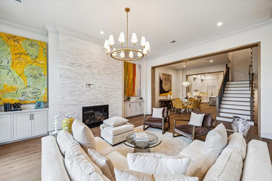 The fireplace features an IntelliFire Touch Ignition System––user-friendly ambience! The floor-to-ceiling white stack stone fireplace features recessed electrical plug and cable conduit leading to the side cabinet for television mounting. The fireplace features an IntelliFire Touch Ignition System––user-friendly ambience! The floor-to-ceiling white stack stone fireplace features recessed electrical plug and cable conduit leading to the side cabinet for television mounting.