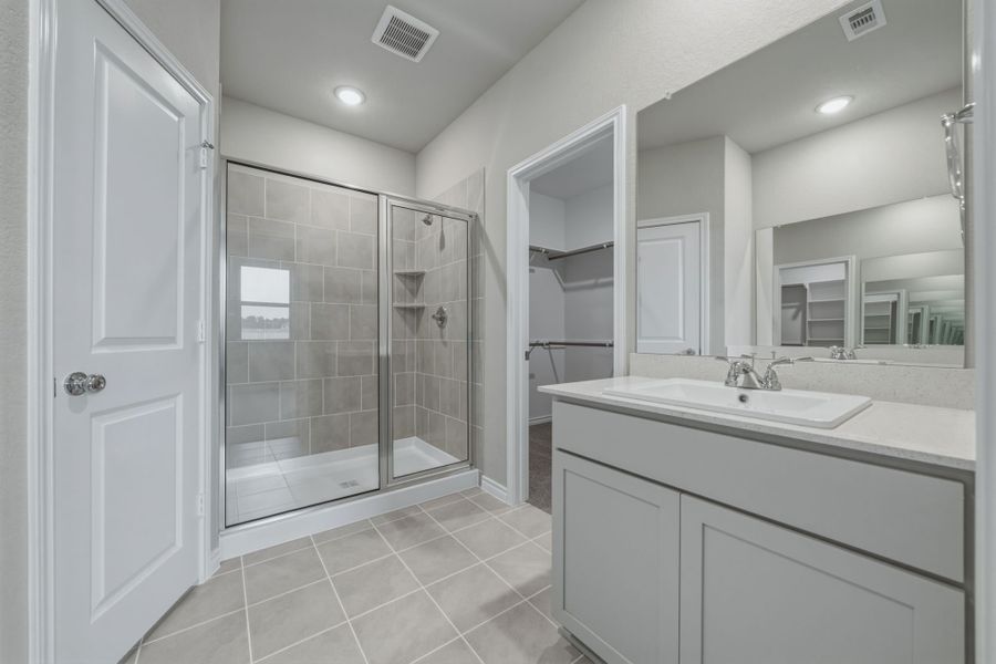 Primary Bathroom in the Cedar home plan by Trophy Signature Homes – REPRESENTATIVE PHOTO Primary Bathroom in the Cedar home plan by Trophy Signature Homes – REPRESENTATIVE PHOTO