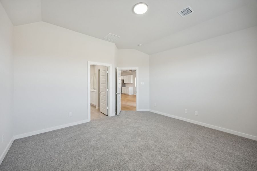 Primary Suite in the Oak II home plan by Trophy Signature Homes – REPRESENTATIVE PHOTO