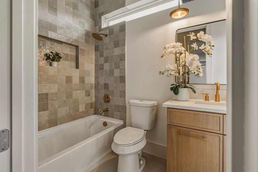 Full bath featuring vanity and shower / tub combination