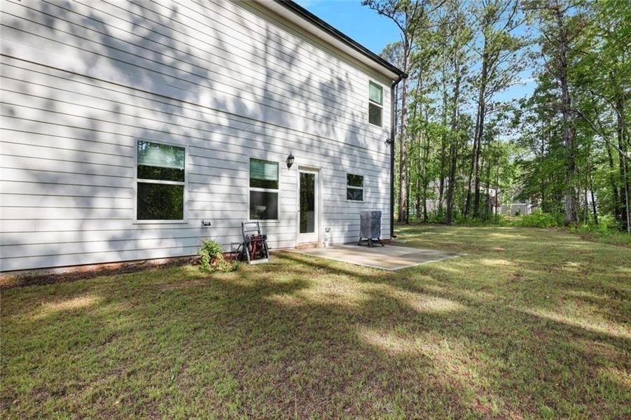 Exterior details and patio area of a home in Bryson Lake, Douglasville (Image 3).