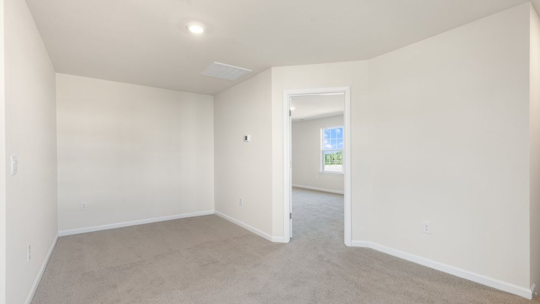 Spacious, unfurnished interior of a new home in The Grove at Matthews Landing, Fuquay Varina (Image 22).