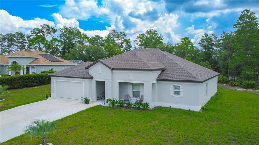 Front exterior of a new home in , Homosassa, FL, highlighting curb appeal (Image 22). Front exterior of a new home in , Homosassa, FL, highlighting curb appeal (Image 22).