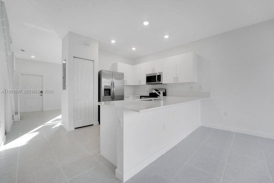 Furnished interior view inside a new home in , Homestead (Image 6). Furnished interior view inside a new home in , Homestead (Image 6).