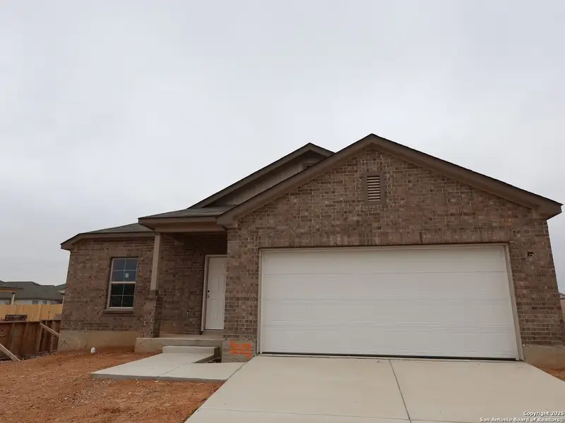Front exterior of a new home in Paloma Park, Converse, TX, highlighting curb appeal (Image 14).