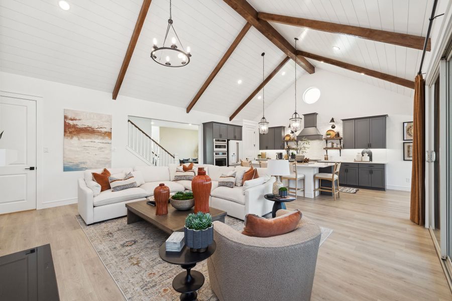 Great room with vaulted ceiling and stained ceiling beams Great room with vaulted ceiling and stained ceiling beams