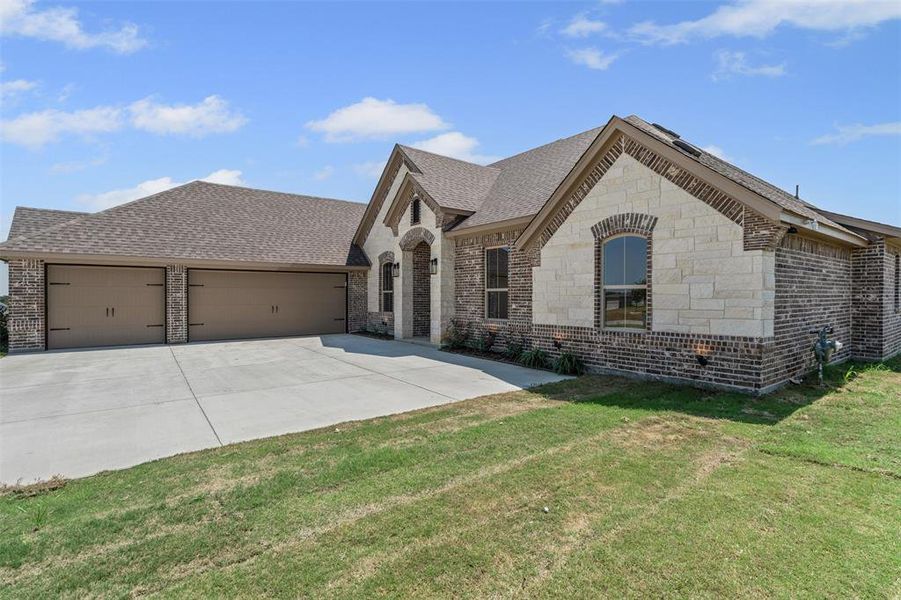 Front exterior of a new home in , Godley, TX, highlighting curb appeal (Image 21).