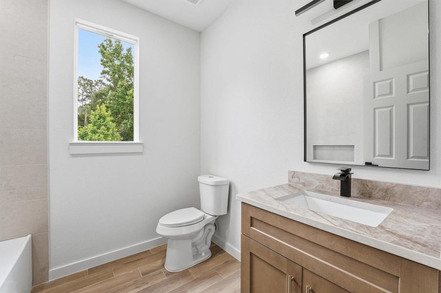 Furnished interior view inside a new home in , Conroe (Image 12).