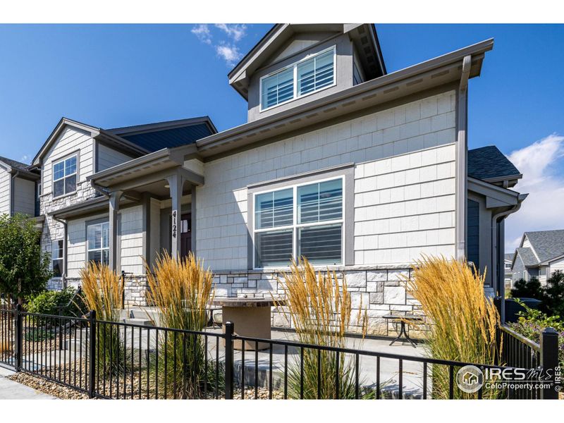 Front exterior of a new home in , Loveland, CO, highlighting curb appeal (Image 21).