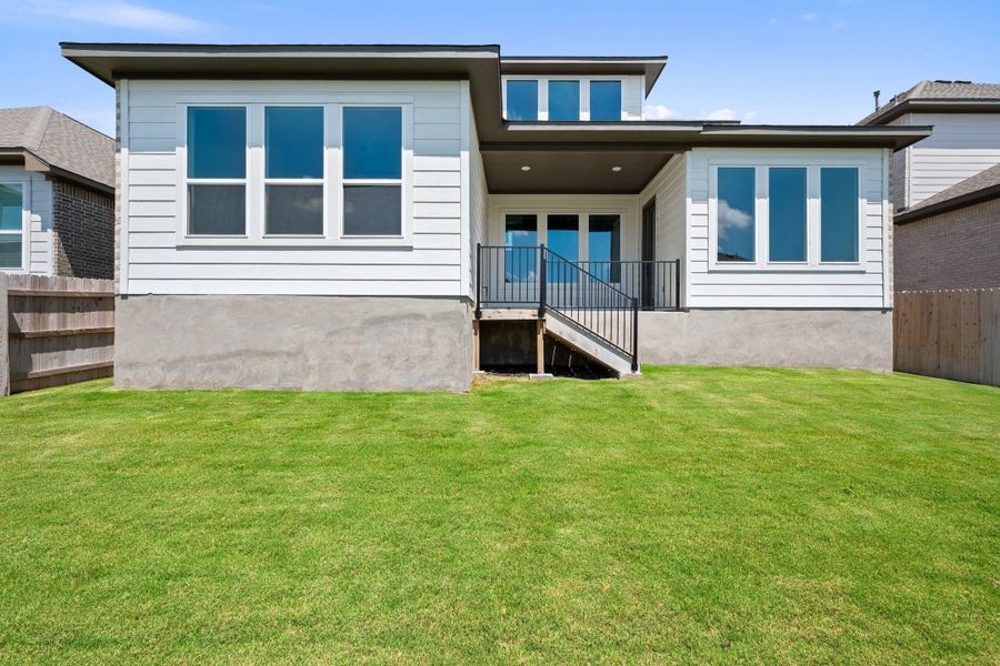 Exterior details and patio area of a home in Lariat, Liberty Hill (Image 26).