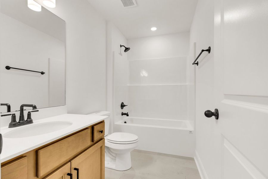 Representative furnished interior of a home built from the Titusville II by Regent Homes in Marlon's Creek, Spring Hill (Image 12).