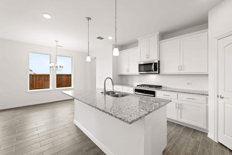 Representative furnished interior of a home built from the Blackburn by UnionMain Homes in Reunion, Rhome (Image 7).