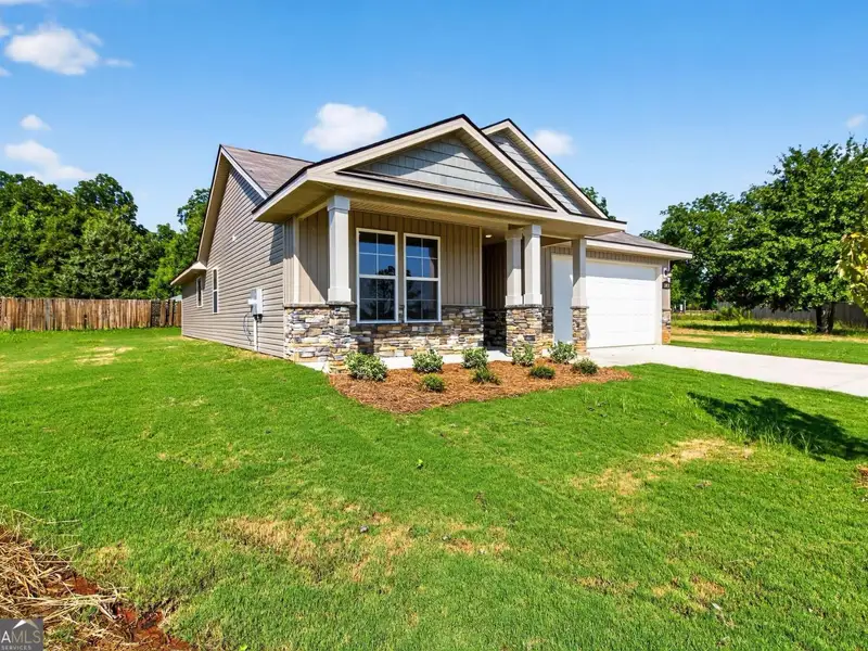 Exterior details and patio area of a home in Ivy Glen, Perry (Image 3).