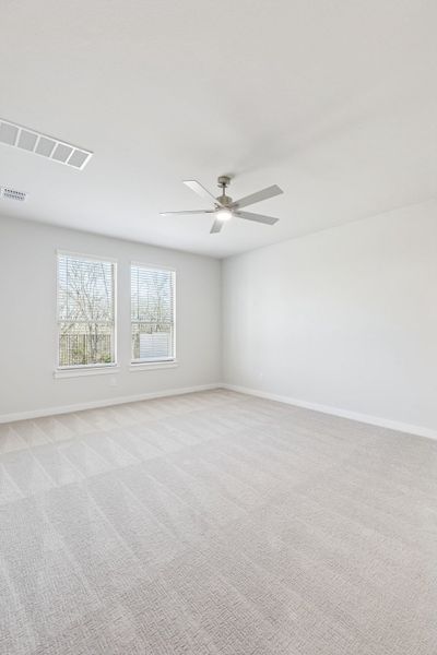 Primary Suite in the Masters home plan by Trophy Signature Homes – REPRESENTATIVE PHOTO