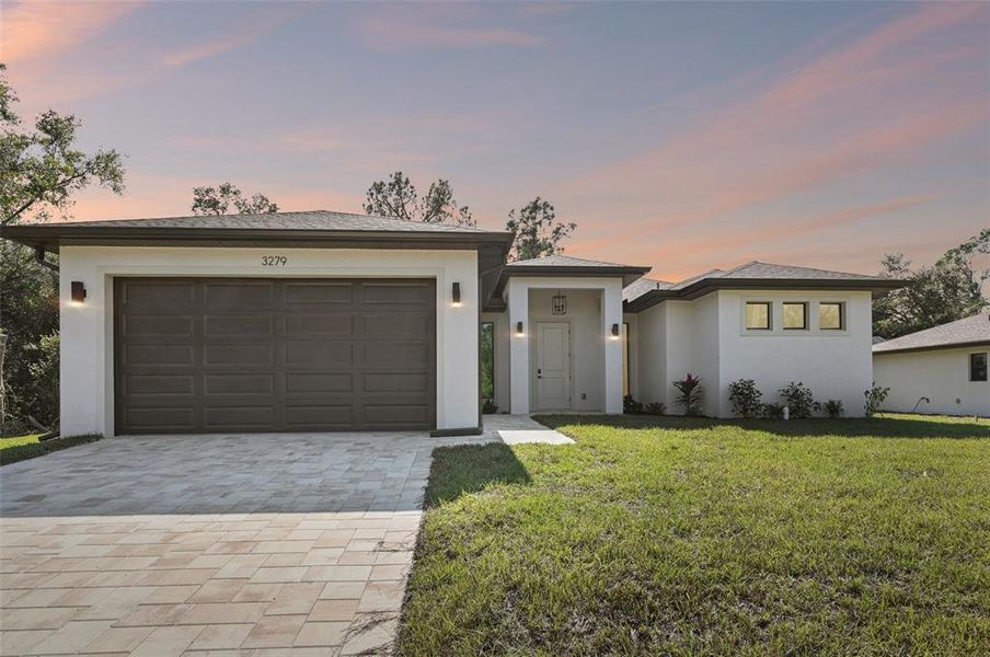 Front exterior of a new home in , North Port, FL, highlighting curb appeal (Image 1).