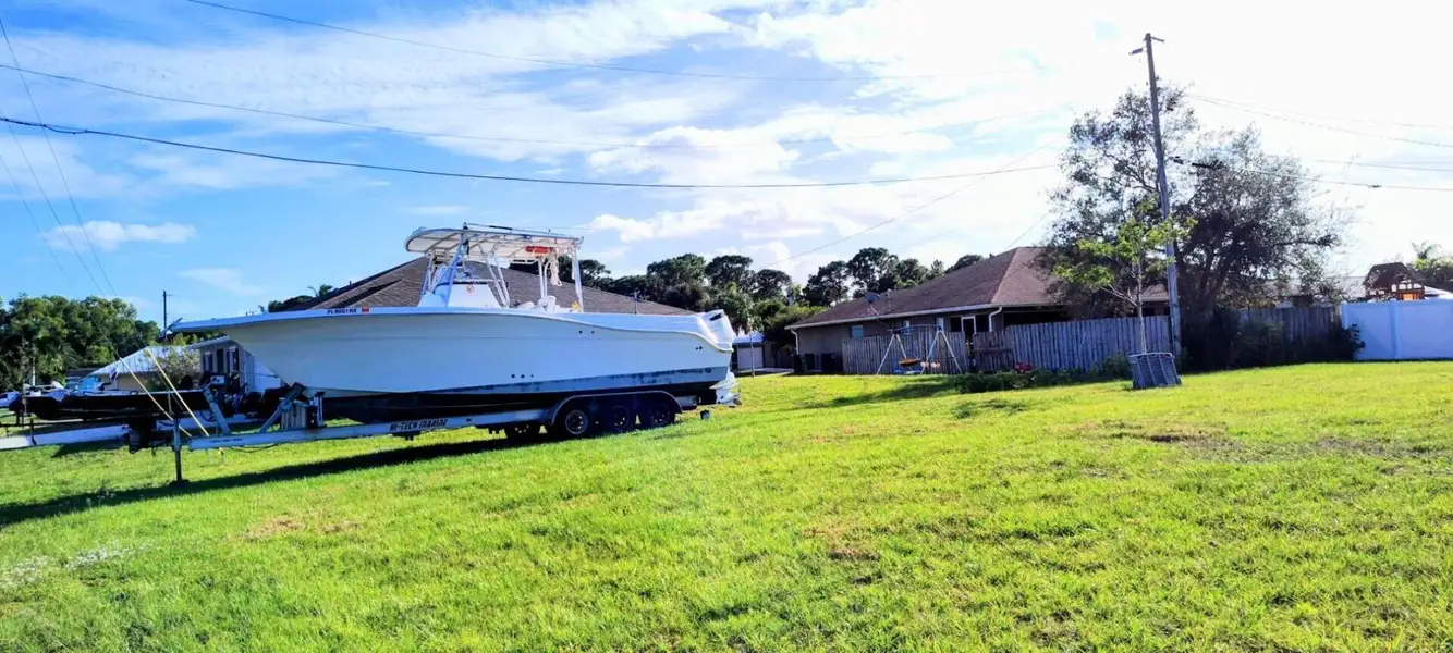 View of Backyard with Huge Boat