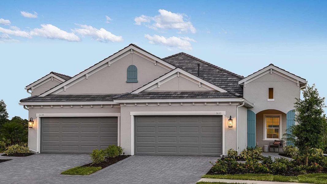 Front exterior of a new home in Windward, Lakewood Ranch, FL, highlighting curb appeal (Image 2). Front exterior of a new home in Windward, Lakewood Ranch, FL, highlighting curb appeal (Image 2).