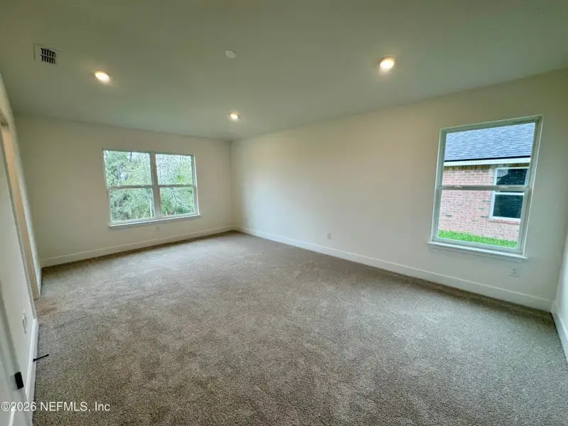 Spacious, unfurnished interior of a new home in Shadow Crest at Rolling Hills, Green Cove Springs (Image 11).