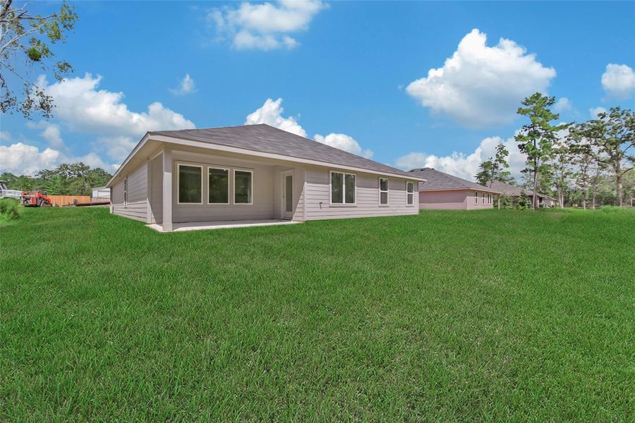 Front exterior of a new home in Williams Reserve East, Conroe, TX, highlighting curb appeal (Image 2).