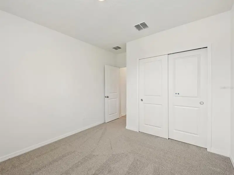 Spacious, unfurnished interior of a new home in The Reserve at Van Oaks, Auburndale (Image 17).