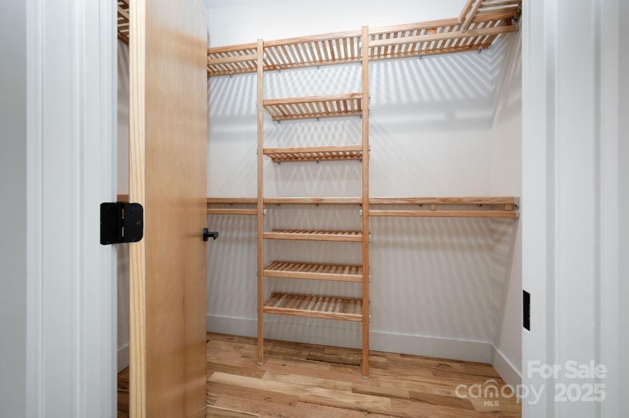 Walk-In Closet with Custom Wood Organization Walk-In Closet with Custom Wood Organization