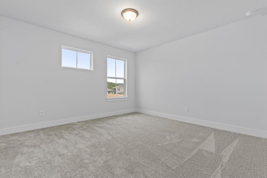 Unfurnished room with carpet floors