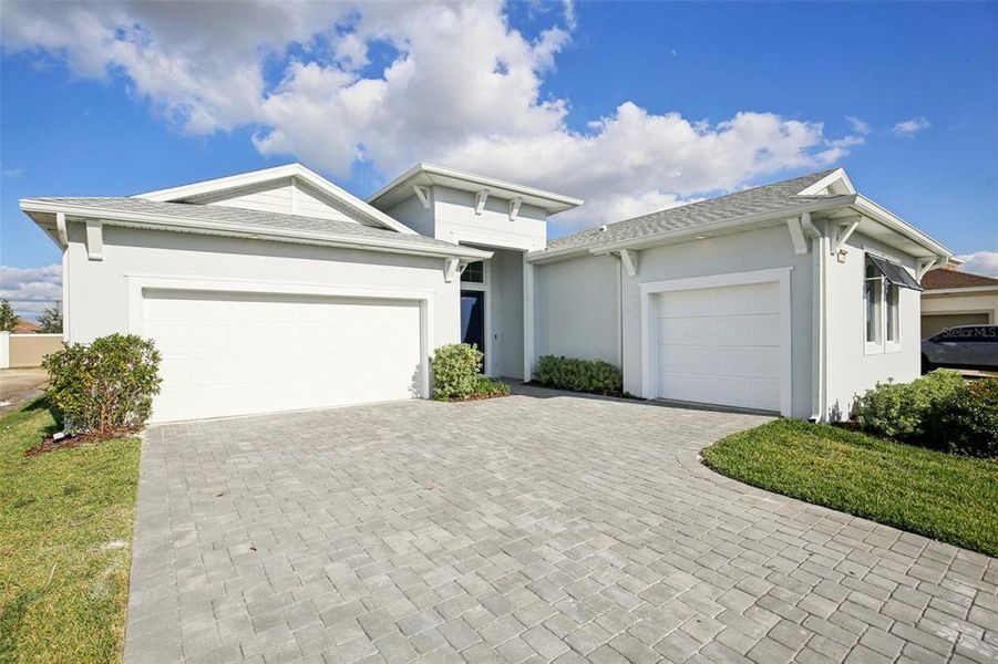 Front exterior of a new home in Eagles Cove at Mirada, San Antonio, FL, highlighting curb appeal (Image 23).