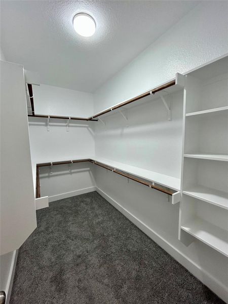 Primary walk in closet.