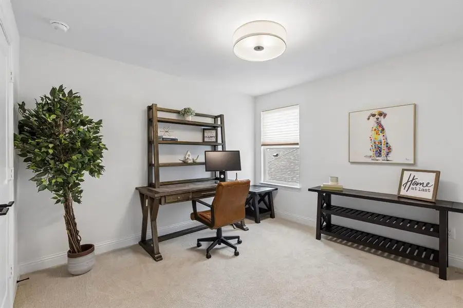 Versatile and comfortable, this secondary bedroom provides ample space for guests, hobbies, or a home office while maintaining a light and airy feel.