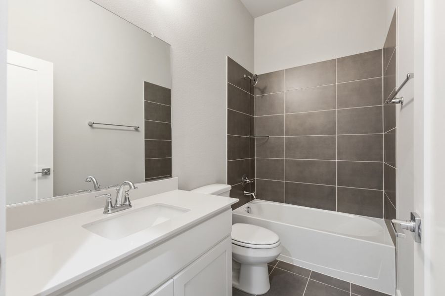 Bathroom in the Gilmour home plan by Trophy Signature Homes – REPRESENTATIVE PHOTO Bathroom in the Gilmour home plan by Trophy Signature Homes – REPRESENTATIVE PHOTO