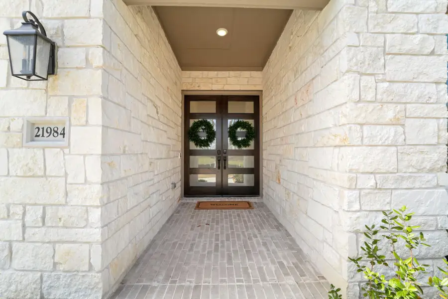 Exterior details and patio area of a home in The Highlands - 65', Porter (Image 4).