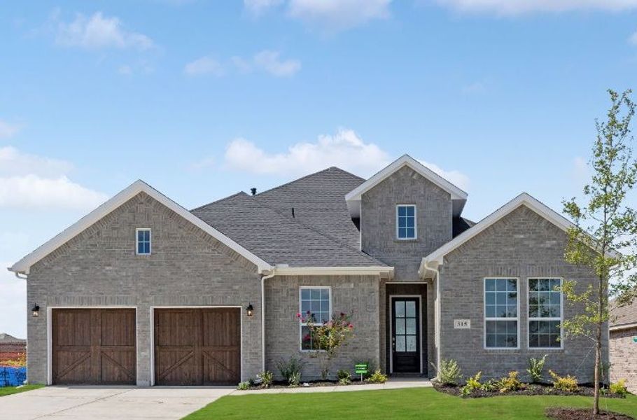 Representative exterior photo of a completed home built from the Hawkins by UnionMain Homes in Myrtle Creek, Waxahachie, TX (Image 1). Representative exterior photo of a completed home built from the Hawkins by UnionMain Homes in Myrtle Creek, Waxahachie, TX (Image 1).