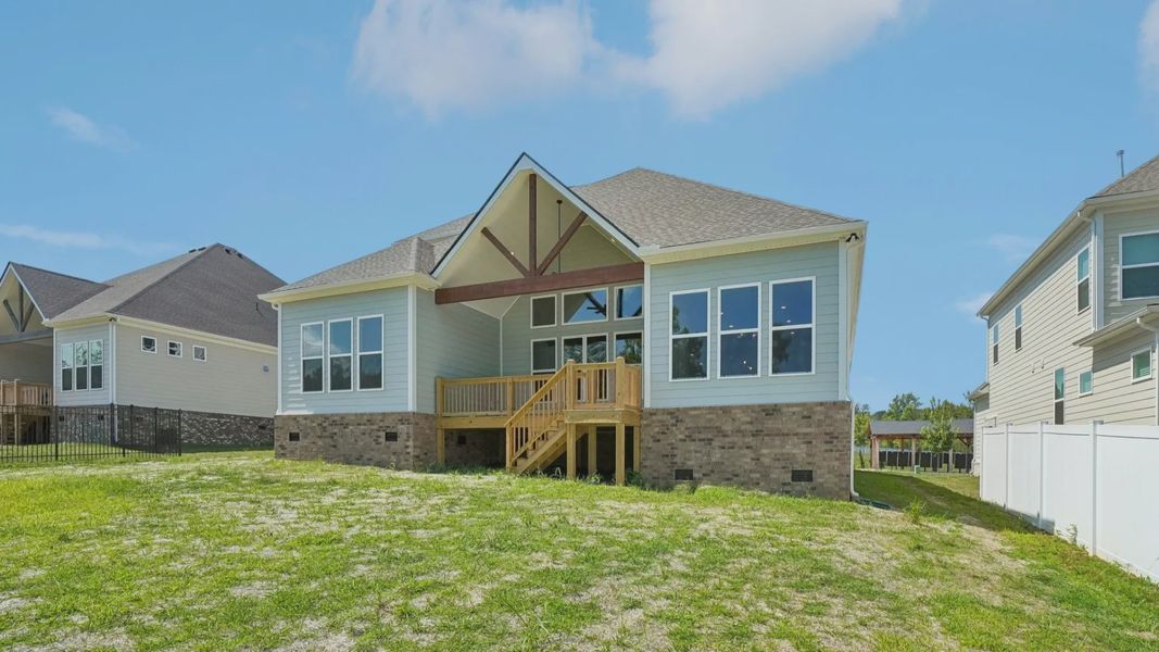Rear exterior view of two-story home featuring back porch