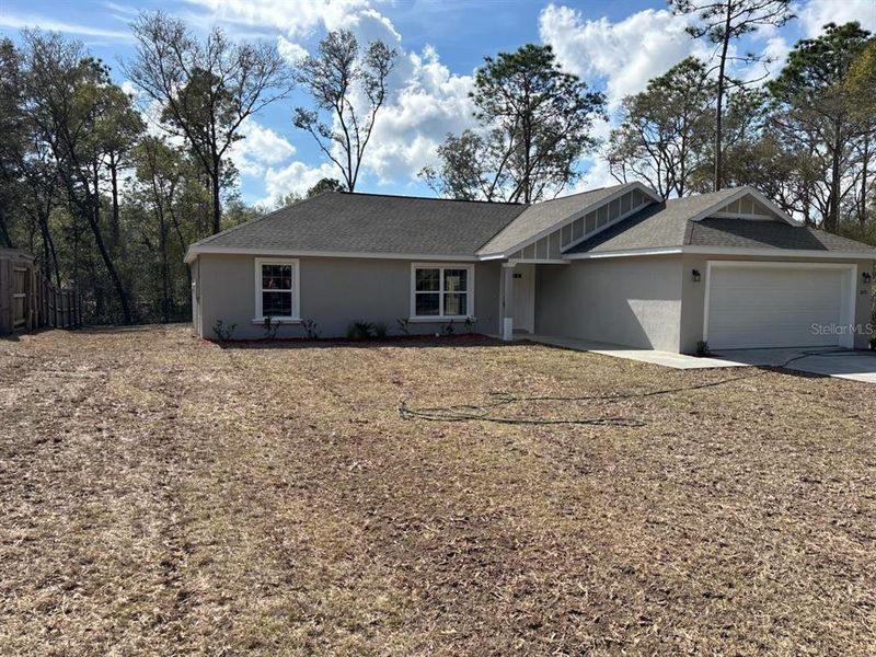Front exterior of a new home in , Citrus Springs, FL, highlighting curb appeal (Image 22).