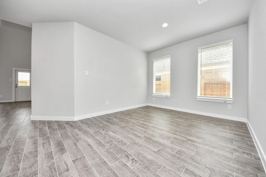 Make memories gathered around the table with your family and friends! This spacious dining room features elegant flooring, custom paint, and adjacent to family room and kitchen for open concept feel.